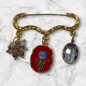 Gold and Red Enamel Brooch with Blue Accent